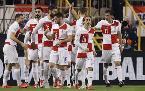 epa11976813 Croatia's Ante Budimir (R) celebrates with his teammates after for the 1-0 goal during the UEFA Nations League quarterfinal, 1st leg soccer match between Croatia and France in Split, Croatia, 20 March 2025.  EPA/ANTONIO BAT