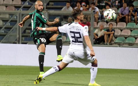 Sassuolo's Simone Zaza (L) kicks in a goal during the Italian Serie A soccer match US Sassuolo vs Cagliari Calcio at Mapei Stadium in Reggio Emilia, Italy, 31 August 2014.ANSA/ELISABETTA BARACCHI