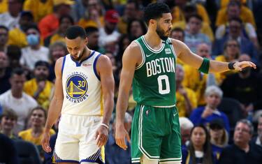 Boston - June 2: The Warriors not only lost the game, but Stephen Curry (30) also lost a sneaker in the process, the Celtics Jayson Tatum is at right. The Boston Celtics visited the Golden State Warriors for Game One of the NBA Finals at the Chase Center in San Francisco, CA on June 2, 2022. (Photo by Jim Davis/The Boston Globe via Getty Images)