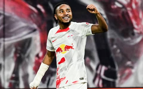 epa10296995 Leipzig's Christopher Nkunku celebrates after scoring the 2-0 goal during the German Bundesliga soccer match between RB Leipzig and SC Freiburg in Leipzig, Germany, 09 November 2022.  EPA/FILIP SINGER (ATTENTION: The DFL regulations prohibit any use of photographs as image sequences and/or quasi-video.)