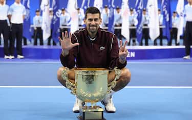 BEIJING, CHINA - OCTOBER 06: Novak Djokovic of Serbia poses with the trophy during the medal ceremony after winning the Men's Singles final match against Alex De Minaur of Australia on day seven of China Open at the National Tennis Center on October 06, 2026 in Beijing, China. (Photo by Lintao Zhang/Getty Images)