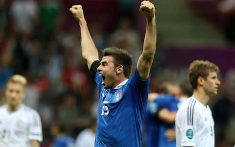 epa03286954 Italian player Andrea Barzagli celebrates in front of German players after the semi final match of the UEFA EURO 2012 between Germany and Italy in Warsaw, Poland, 28 June 2012. Italy won 2-0.  EPA/OLIVER WEIKEN UEFA Terms and Conditions apply http://www.epa.eu/downloads/UEFA-EURO2012-TCS.pdf