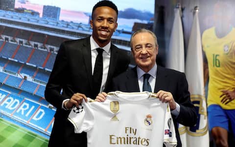 epa07707293 Real Madrid's President, Florentino Perez (R) and Brazilian defender Eder Militao pose for the photographers during the presentation of the player at Santiago Bernabeu Stadium, in Madrid, Spain, 10 July 2019.  EPA/Juanjo Guillen