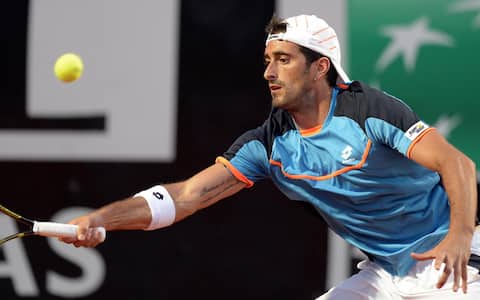 Italian tennis player Potito Starace returns the ball to Swiss tennis player Roger Federer  during their Italian Open tennis tournament match played at the Foro Italico in Rome, Italy, 14 May 2013. ANSA/CLAUDIO ONORATI
