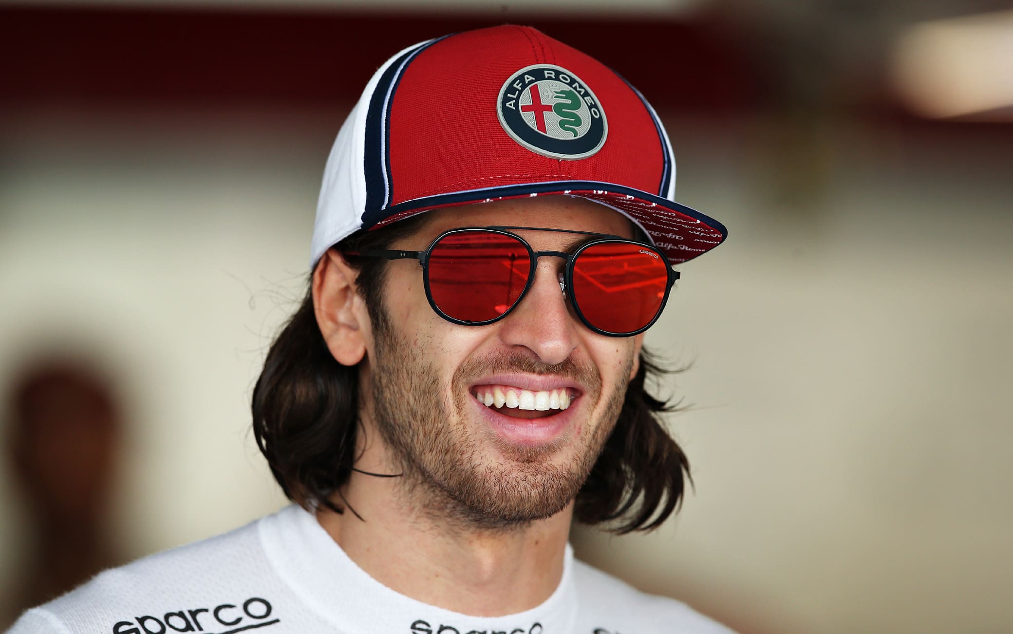 ABU DHABI, UNITED ARAB EMIRATES - NOVEMBER 29: Antonio Giovinazzi of Italy and Alfa Romeo Racing looks on in the garage before practice for the F1 Grand Prix of Abu Dhabi at Yas Marina Circuit on November 29, 2019 in Abu Dhabi, United Arab Emirates. (Photo by Charles Coates/Getty Images)
