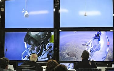 epa03433059 A handout photograph released by Red Bull Stratos on 14 October 2012 showing pilot Felix Baumgartner of Austria seen in a screen at mission control center in the capsule during the final manned flight for Red Bull Stratos in Roswell, New Mexico, USA on 14 October 2012.&nbsp;Reports state that Austrian skydiver Felix Baumgartner is hoping to become the first person to break the sound-barrier without a vehicle. Baumgartner is jumping from a balloon at more than 36.5km above Roswell, New Mexico,USA.  EPA/STEFAN AUFSCHAITER / RED BULL STRATOS / HANDOUT  HANDOUT EDITORIAL USE ONLY/NO SALES
