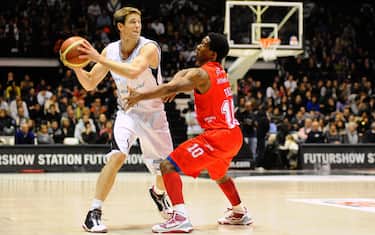BOLOGNA, ITALY - DECEMBER 19: Petteri Koponen # 6 of Canadian Solar Bologna competes with Morris Finley #10 of Armani Jeans Milano during the Lega Basket Serie A match between Canadian Solar Virtus Bologna and Armani Jeans Milano at Futurshow Station on December 19, 2010 in Bologna, Italy.  (Photo by Roberto Serra - Iguana Press/Getty Images) *** Local Caption *** Petteri Koponen;Morris Finley