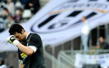 Juventus Gianluigi Buffon reacts after Parma's third goal during the Serie A soccer match between Juventus and Parma at the Olympic Stadium in Turin, Italy, Sunday, May 9, 2010. Juventus lost 3 - 2. (AP Photo/Massimo Pinca)
