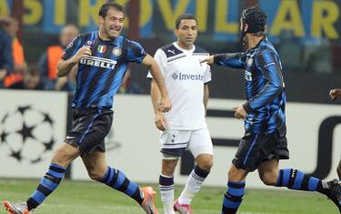 Inter Milan Dejan Stankovic (L) celebrates after scoring with teammate Cristian Chivu as Tottenham Aaron Lennon observes them during ther Champions League match against Tottenhan at the Meazza stadium in Milan, Wednesday 20 October 2010. ANSA/DANIEL DAL ZENNARO