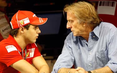 Ferrari President Luca Cordero di Montezemolo, right, talks to Felipe Massa  during the 2nd free practice session at the Yas Marina racetrack , in Abu Dhabi, United Arab Emirates, Friday, Oct.30, 2009. The Emirates Formula One Grand Prix will take place on Sunday, Nov.1. (AP Photo/Kamran Jebreili)