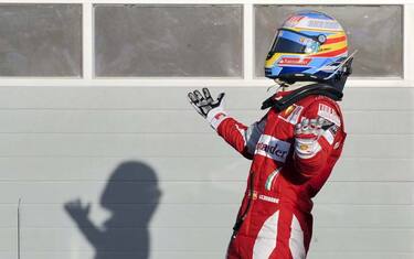 epa02079102 Spanish Formula One driver Fernando Alonso of Scuderia Ferrari celebrates after winning the Formula One Grand Prix of Bahrain at the Bahrain International Circuit in Sakhir, Bahrain, 14 March 2010. Alonso won ahead of his second placed Brazilian teammate Felipe Massa and third placed British Formula One driver Lewis Hamilton of McLaren Mercedes.  EPA/MAZEN MAHDI