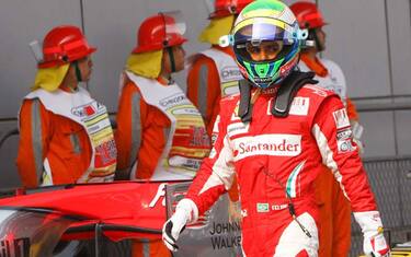 epa02120754 Brazilian Formula One driver Felipe Massa of Scuderia Ferrari walks in the parc ferme at the end of the qualifying session at the Shanghai International circuit, in Shanghai, China, 17 April 2010. The 2010 Chinese Formula One Grand Prix will take place on 18 April 2010.  EPA/HOW HWEE YOUNG