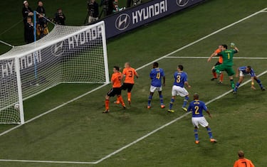 Brazil's Felipe Melo, top right, scores an own goal during the World Cup quarterfinal soccer match between the Netherlands and Brazil at Nelson Mandela Bay Stadium in Port Elizabeth, South Africa, Friday, July 2, 2010.  (AP Photo/Michael Sohn)