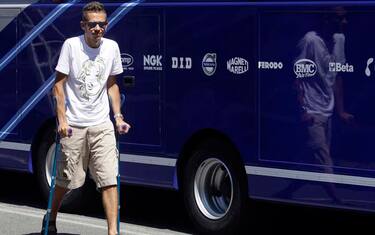 Yamaha MotoGP rider Valentino Rossi from Italy walks on crutches to attend a training session at the cirquit in city of Brno, Czech Republic, Monday, July 12, 2010. Rossi broke his right leg on June 5, during practice for the Italian Grand Prix. Following the accident he underwent surgery for two-and-a-half hours to repair a displaced and exposed fracture of his right tibia. (AP Photo/Petr David Josek)