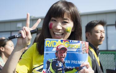 MOTEGI, JAPAN - OCTOBER 11:  A fan of Valentino Rossi smiles in paddock during the MotoGP Of Japan - Qualifying at Twin Ring Motegi on October 11, 2014 in Motegi, Japan.  (Photo by Mirco Lazzari gp/Getty Images)