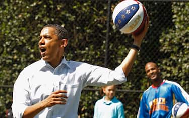 WASHINGTON, DC - APRIL 25:  (AFP OUT) U.S. President Barack Obama shoots a basketball while participating in a "Let's Move" clinic with members of the NBA, WNBA and the Harlem Globetrotters during the White House Easter Egg Roll on the South Lawn of the White House April 25, 2011 in Washington, DC. About 30,000 people are expected to attend the 133-year-old tradition of rolling colored eggs down the White House lawn.  (Photo by Chip Somodevilla/Getty Images)