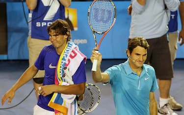 epa01991623 Roger Federer (R) of Switzerland and Rafael Nadal (L) of Spain gestures after an exhibition doubles match to raise funds for victims of the Haiti earthquake, in Melbourne, Australia, 17 January 2010. World number one Roger Federer enlisted top players for the charity match the day before the start of the Australian Open, including Serena Williams of the US, Kim Clijsters of Belgium, Novak Djokovic of Serbia, Sam Stosur of Australia and Lleyton Hewitt of Australia.  EPA/FRANCIS R. MALASIG