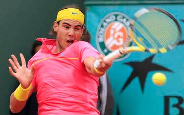 Spain's Rafael Nadal returns the ball to  Russia's Teimuraz Gabashvili during their second round match at the Roland Garros stadium in Paris, Wednesday May 27, 2009. (AP Photo/Bernat Armangue)