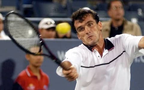 USO28 - 19990903 - FLUSHING MEADOWS, NEW YORK, UNITED STATES : Cristiano Caratti of Italy hits a forehand to Goran Ivanisevic of Croatia  during their match on Friday 03 September, 1999 at the US Open in Flushing Meadows, New York.  (ELECTRONIC IMAGE)   EPA PHOTO AFP/STAN HONDA/SH/DEC