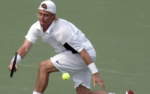 epa000256822 Lleyton Hewitt of Australia returns the ball to Cyril Saulnier of France during the quarterfinals match at the Legg Mason Tennis Classic on Friday, 20 August  2004.  EPA/MARK F. SYPHER  EPA MARK F. SYPHER