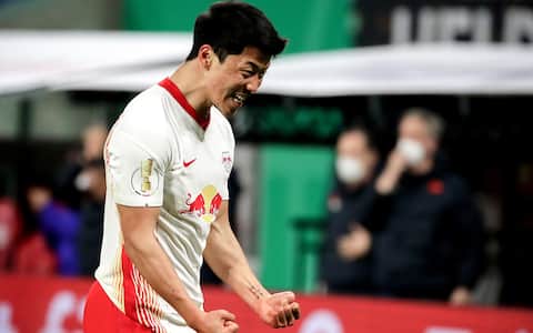 epa09050078 Leipzig's Hee-chan Hwang celebrates after scoring the 2-0 lead during the German DFB Cup quarter final soccer match between RB Leipzig and VfL Wolfsburg in Leipzig, Germany, 03 March 2021.  EPA/FILIP SINGER / POOL DFB regulations prohibit any use of photographs as image sequences and/or quasi-video.