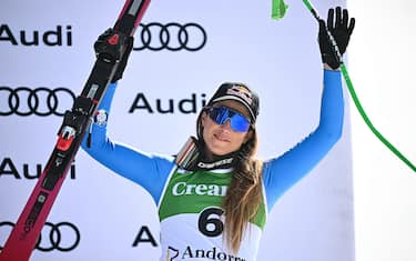 Third-placed Italy's Sofia Goggia celebrates on the podium of the women's downhill race, part of the FIS Alpine Ski World Cup 2025-2026 in Soldeu, Andorra on February 26, 2026. (Photo by Lionel BONAVENTURE / AFP via Getty Images)
