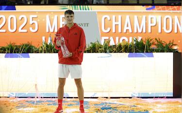 Mar 30, 2025; Miami, FL, USA; Jakub Mensik (CZE) celebrates with the Butch Buchholz championship trophy after his match against Novak Djokovic (SRB)(not pictured) in the men's singles championship of the Miami Open at Hard Rock Stadium. Mandatory Credit: Geoff Burke-Imagn Images/Sipa USA